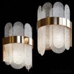 Two elegant gold and white wall lights with clear glass, adding a touch of sophistication to any room decor.