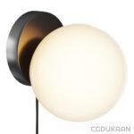 Wall-mounted light fixture with a black base and a frosted white glass globe shade.