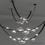 A modern chandelier with curved black metal arms and round glass light bulbs hanging from the ceiling.