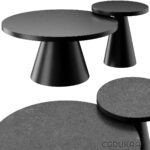 Three black round modern coffee tables with circular bases of varying sizes arranged together.