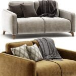 3d model of Cozy couch with a soft blanket draped over it.