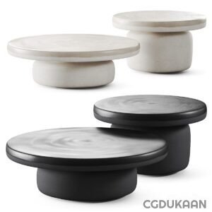 Three black and white round tables with white bases, creating a sleek and modern look.