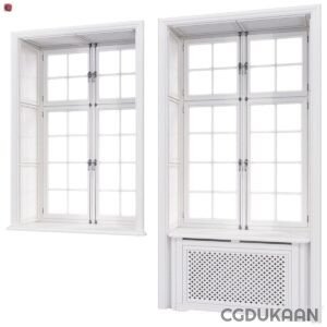 A pair of windows featuring white frames and partially closed window covers.