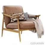 Brown leather chair with cozy blanket and pillows.