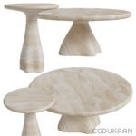 Three marble tables with pedestal bases in a room with elegant decor.