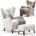 Two chairs and a footstool with a blanket, creating a cozy seating arrangement.