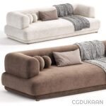 Two cozy couches adorned with pillows and blankets, inviting you to relax and unwind.