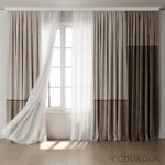 Window with white curtains and silver curtain rod.